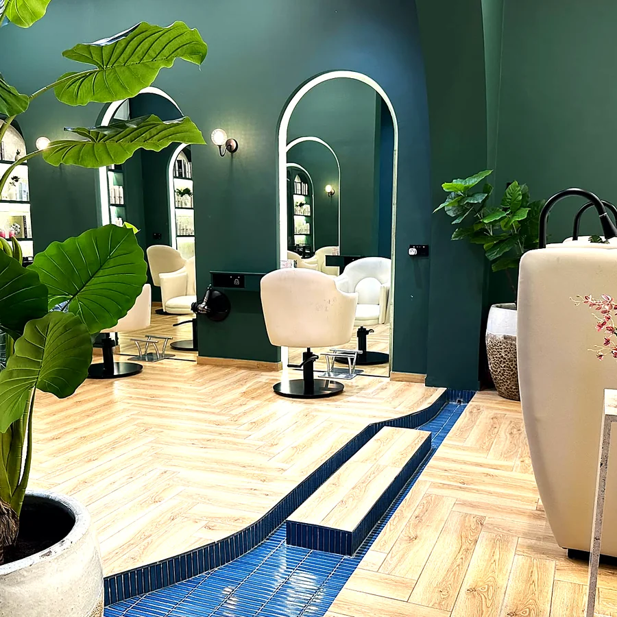 Styling chairs and arched mirrors on the salon floor