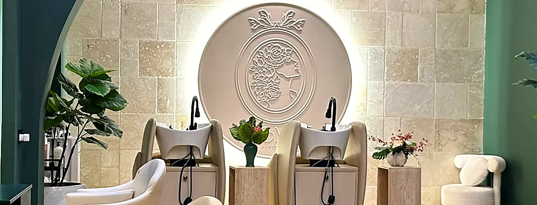 The hair spa chairs and wash basins beneath the Promise cameo